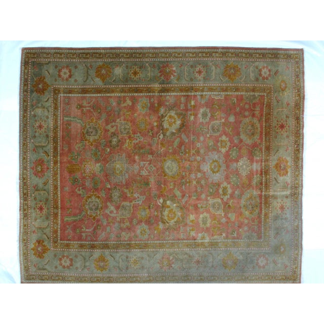 This master piece is a wool on wool pile hand woven Turkish Oushak carpet with minor wear.