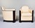 This pair of French Art Deco club chairs embodies the movement's defining geometry. Each chair features the iconic tub...
