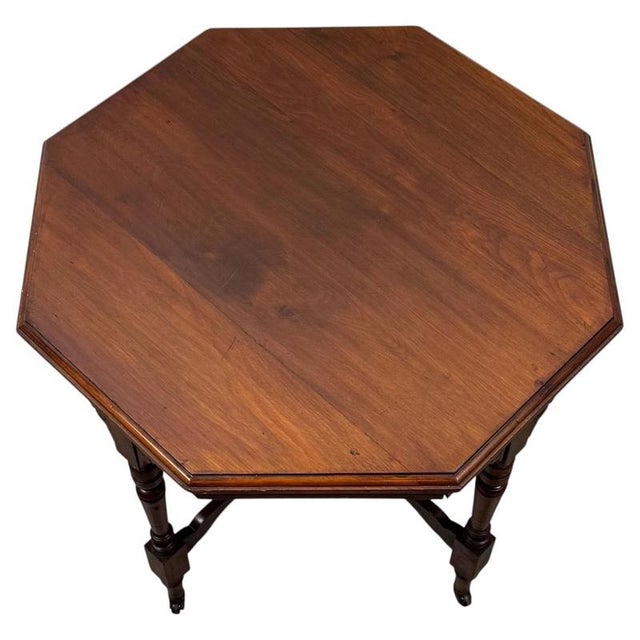 A charming and unusually shaped 20th-century mahogany side table, combining traditional styling, elegant proportions and...