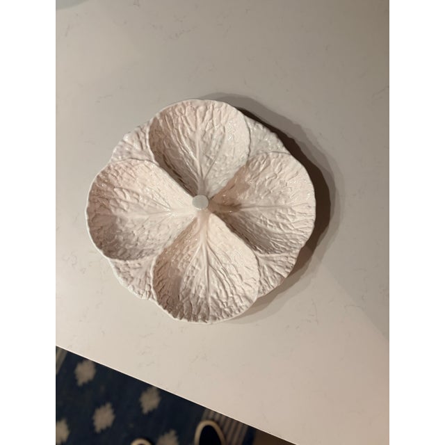 Made in Portugal in the style of Bordallo Pinheiro, this classic white cabbage ware serving dish is divided into four...