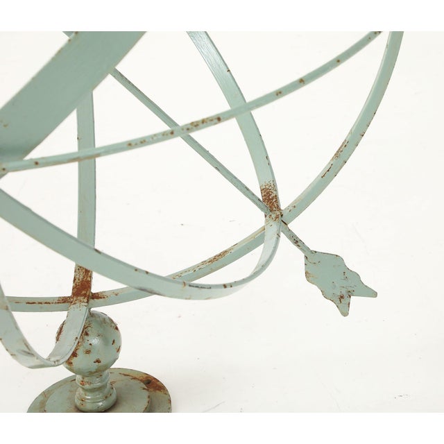 This vintage garden armillary features an open metal frame and a weathered green finish with a beautiful patina. It stands...