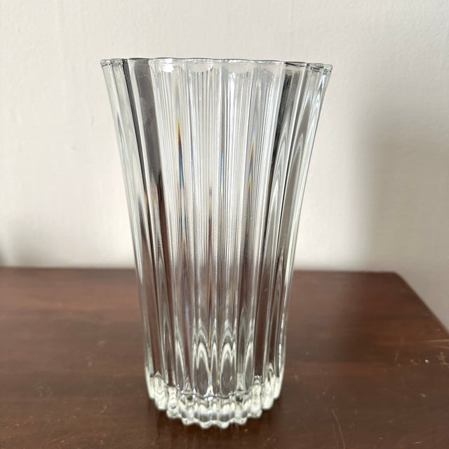 Esquisite crystal vase made in France that has a scalloped top, ribbed sides that create a nice sparkle and irredescence...