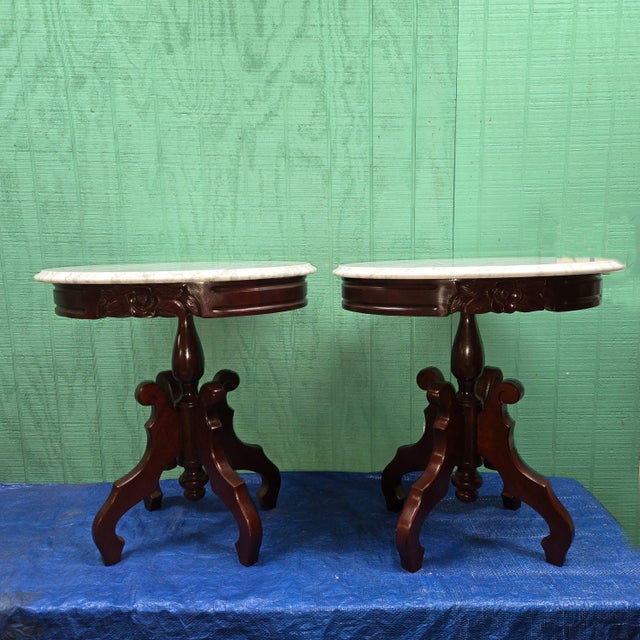 This pair of marble top tables is absolutely gorgeous. Each table base features a rose embellishment and a dark stain to...