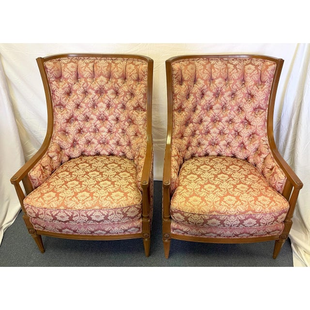 Vintage pair of regency style high back chairs from the 1960's. Each has a solid fruitwood frame in a honey tone finish...