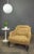 A handsome French armchair dating to the 19th century, featuring deep tufted suede upholstery accented with distinctive...