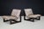 A striking pair of leather sling lounge chairs by Dreipunkt International, Germany, dating from the 1970s. Combining dark...