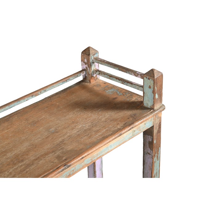 This Vintage Indian Teakwood Shelf or Small Bookcase is handcrafted from solid teakwood, featuring three open shelves...