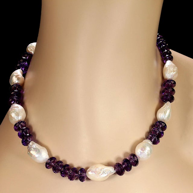 This exquisite 17‑inch necklace is a captivating blend of timeless elegance and natural beauty, designed to highlight the...