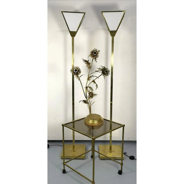 Vintage brass side table on wheels, with smoke glass top- plastic but authentic wheels and smoke glass top. Minor scratches.