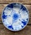 Charming vintage Japanese porcelain bowl featuring a large stylized peony blossom rendered in cobalt blue and white with...