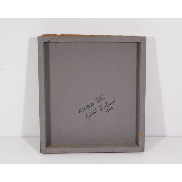 A 1999 mixed media wall assemblage titled ﻿Asoko VIII ﻿by the American artist Juliet Holland (1937-2017). Layers of paint...