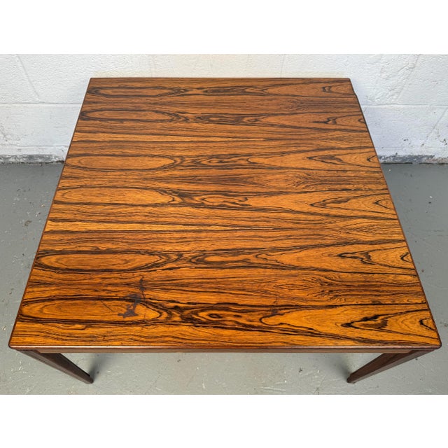 Transform your living area with our exquisite Mid-Century Modern Danish Rosewood Coffee Table, a perfect blend of elegance...