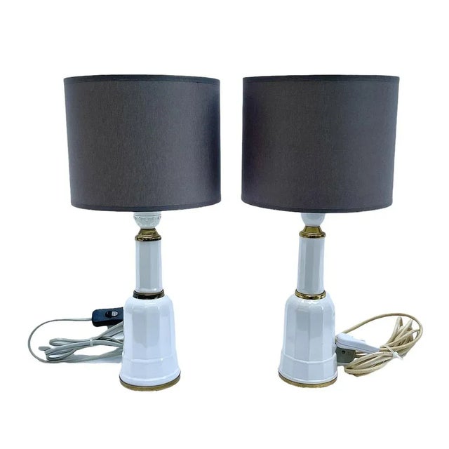 A pair of Scandinavian style lamps. Lamps made of ceramics covered with white glaze. At the point where the ceramic...