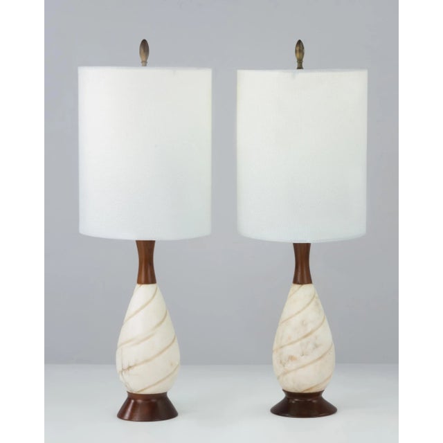 A nice pair of Mid Century Italian alabaster table lamps. Purchased together from a local estate, the bases are slightly...