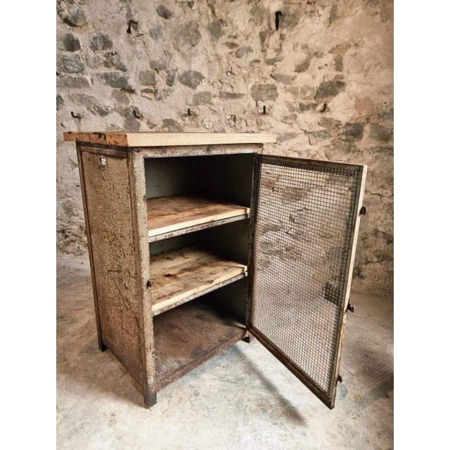 Bring authentic industrial and military history into your interior with this rare french metal cabinet, originally made...