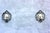 An elegant pair of Italian Rococo Revival wall sconces dating from the mid-20th century, crafted from cast zinc with a...