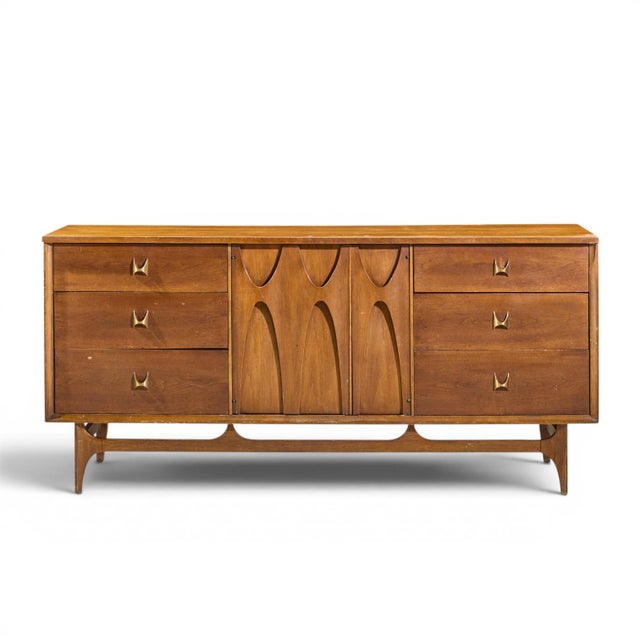 Broyhill Brasilia Mid Century Walnut and Brass 9 Drawer Lowboy Dresser This lowboy measures: 66 wide x 19 deep x 31 inches...