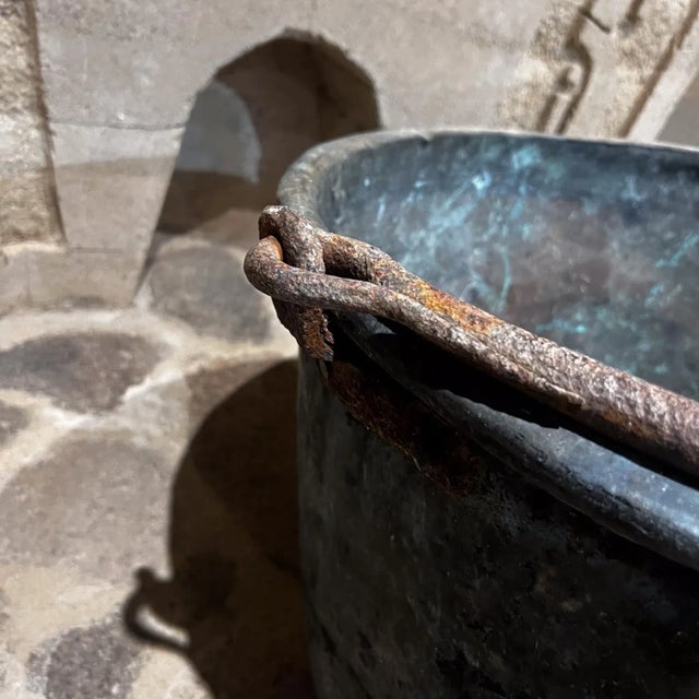 AMBIANIC presents 1900s Antique Patinated Copper Cauldron Pot Forged Iron Handle Perforated detailing. Patinated Fair...