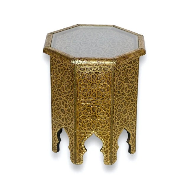 Discover the luxury of Moroccan craftsmanship with our compact golden metal table, a statement piece adorned with...