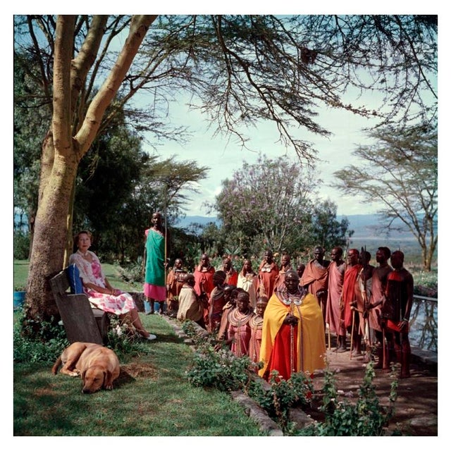 Lady Hamilton 1955 Lady Hamilton rests in the shade of a tree, in the company of a Kenyan tribe. 1955: Slim Aarons Slim...
