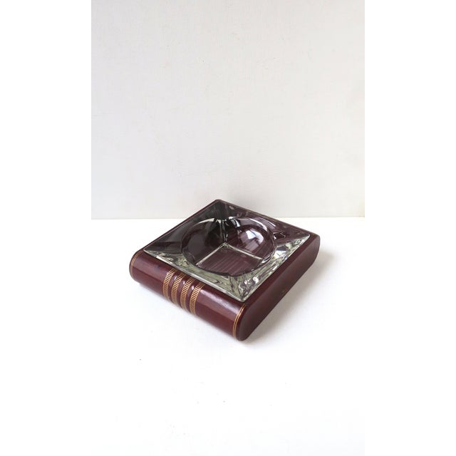 A red burgundy leather and glass ashtray catchall, Art Deco period, circa early to mid-20th century. Piece is red burgundy...