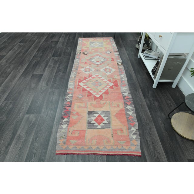 Vintage Turkish Hand-Knotted vintage rug is a semi-antique vintage area rug. The '70s Eastern region of Turkey's unique...