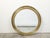 A French vintage brass round mirror from the mid 20th century, with beveled accents. Created in France during the...