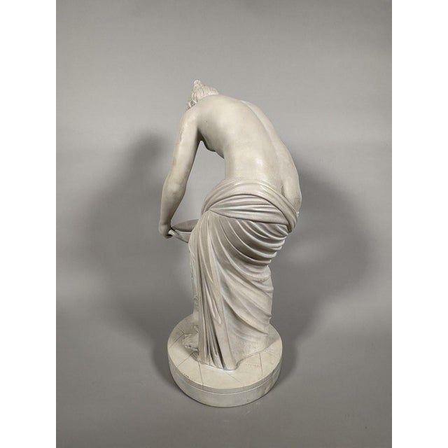 Early 19th-century Neoclassical white marble sculpture. Depicts a Danaid on a basin. The features conform to the canons of...
