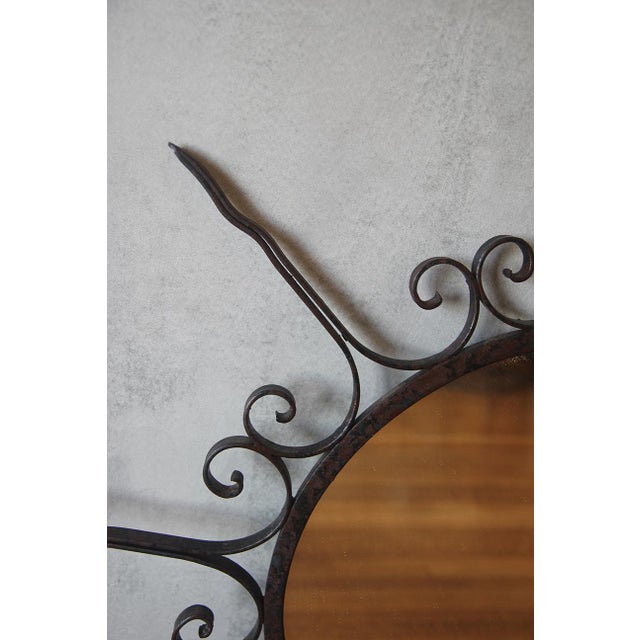 This stunning French wrought iron sunburst mirror dates back to the 1950s and showcases exquisite craftsmanship. The...
