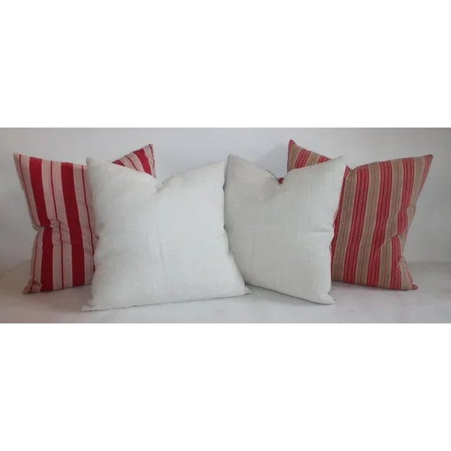 Stripped Ticking pillows with linen backing with down and feather inserts. This item has a zipper to remove and place any...