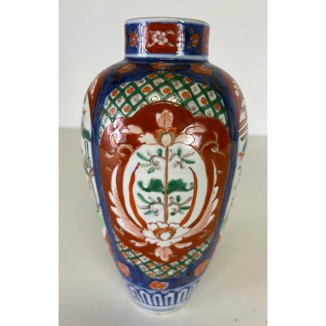 This is a mid-century vintage Japanese export handpainted Amari vase. The vase is hand painted with beautiful floral and...