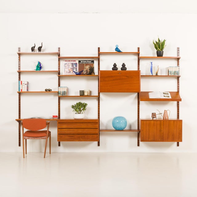 Impressive in scale yet visually light, this four-bay wall unit was designed by poul cadovius for cado in denmark in the...