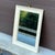 Wall Mirror With Brass Ring Finial by Turner Mfg. Co. Chicago Frame with gold splatter finish over white Mirror view 15.5”...