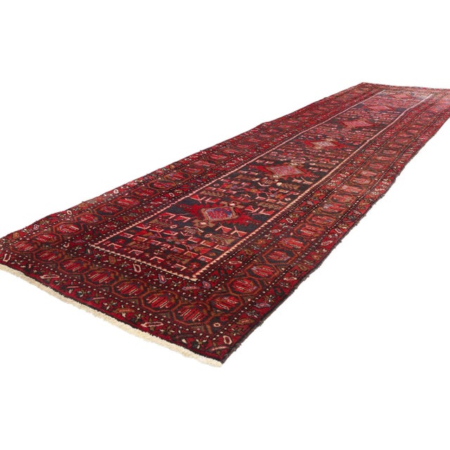 78917 Vintage Persian Heriz Rug Runner, 03'06 x 13'10. This hand-knotted wool vintage Persian Heriz rug runner is a...