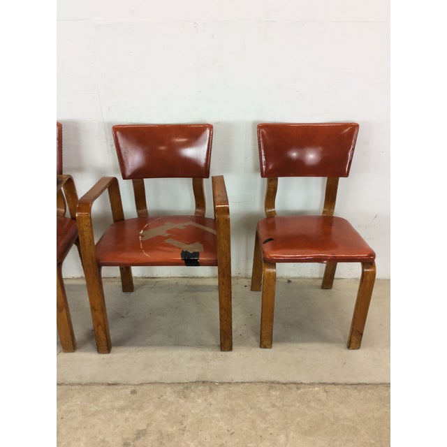 Thus set of four mid century modern dining chairs feature bentwood construction, two arm chairs and two side chairs with...