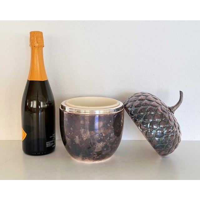 Beautiful silver-plated metal ice bucket from Valsodo, Italy, and Sheffield silver plated. The ice bucket has the shape of...