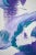 Purple and turquoise swirled together. Purple and turquoise oil paint was pushed around in swirl-like motions with a...