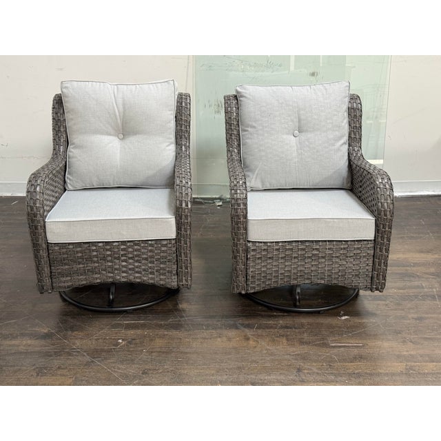 Design Plus Gallery presents a Pair of Gray All Weather Wicker Outdoor Swivel Glider Lounge Chairs. Each chair has a woven...