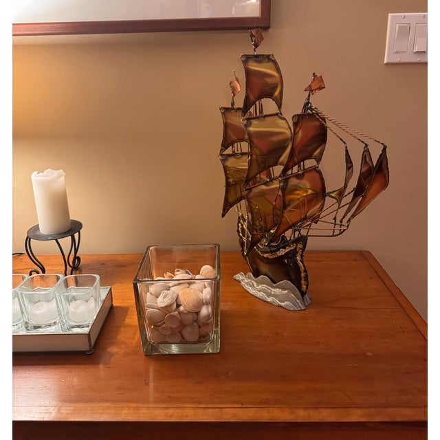 Handcrafted sailboat sculpture originally sourced in Argentina and brought back by the original owner — not mass-produced....