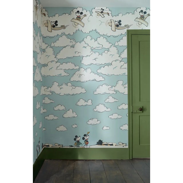 Fly high with Disney`s Mickey Mouse as he glides amongst cotton candy clouds in this beautiful uplifting wallpaper panel....