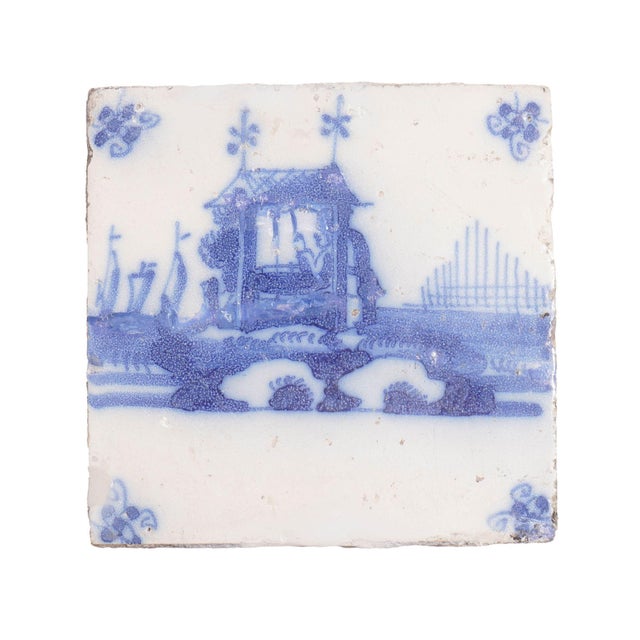 Set of 3 architectural landscape tiles in cobalt underglaze with spider corner decorations. Holland, circa 1700's.