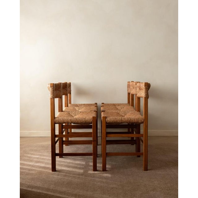 A vintage set of six french mid-century dining chairs in warm stained wood and handwoven natural rush, made in france...