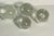 Set of 4 controlled bubbles clear glass paperweights.