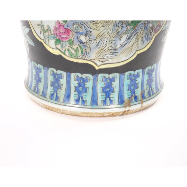 An impressive large 19th century Chinese Export enameled porcelain decorative urn, distinguished by its generous scale,...