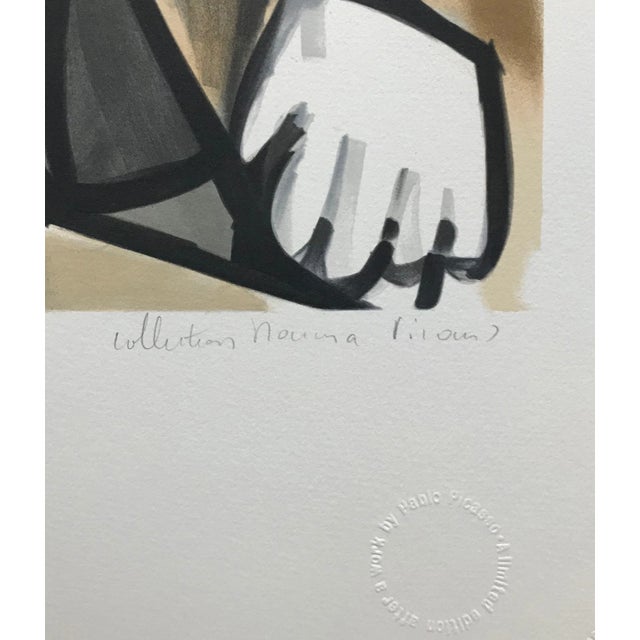 Artist: Pablo Picasso (after) Title: Femme Assise Dans Un Fateuil Medium: Lithograph on Arches paper Sheet size: 29.75 x...