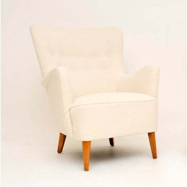 A stylish and extremely comfortable Swedish vintage armchair by Folke Ohlsson for Dux. This is an early model dating from...