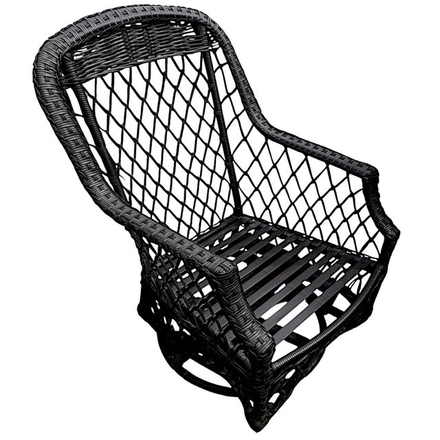 This high back gliding swivel chair made of all-weather espresso toned wicker made by Lane Venture WeatherMaster. It is...