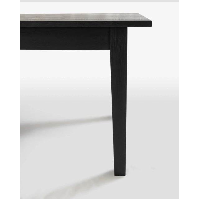 Our modern take on a classic shaker farm table. The New England Farm Table features slim rails, neat but bold reveals, and...