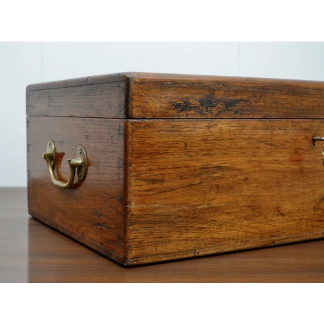 English brass mounted mahogany box with detailed crest and placard. Solid construction from the 19th c having a lovely...
