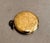 1930s-40s gold-plated round pendant locket. Photographs of original owner still inside. Excellent condition.